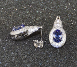 Lot of 57 Sets of Women's Platinum Plated Tanzanite CZ Pendant & Earrings -